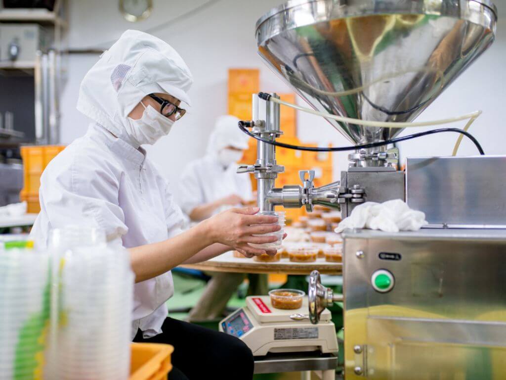 workers working in food processing line