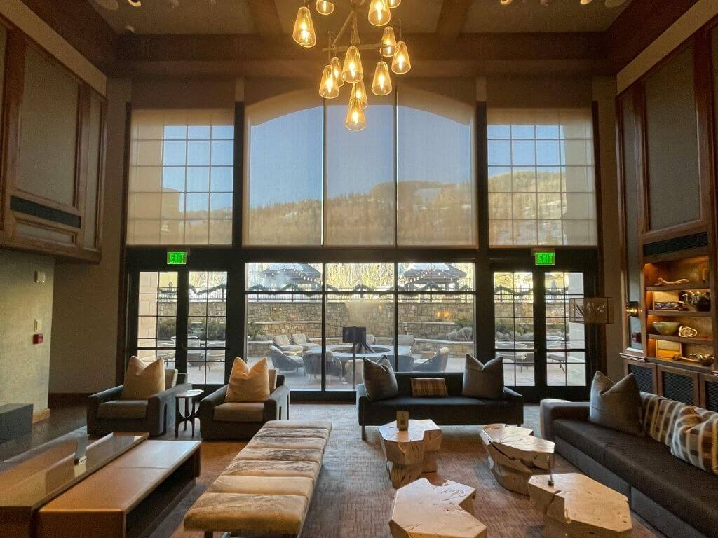 a cozy hotel lobby with mountain view